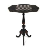 A 19th century ebonised games table with gilt decoration, the shaped top with mother of pearl inlaid