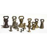 A group of brass weights.