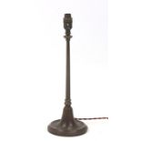 An early 20th century WAS Benson style lamp with loaded circular base and a tapering hexagon column,