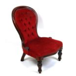 A Victorian walnut spoon back upholstered nursing chair.