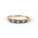 A 9ct gold diamond and sapphire half hoop ring, approx UK size 'Q'.1.5g