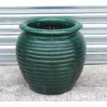 A large green glaze garden planter. 37cm high