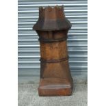 A large Victorian salt glazed earthenware castle top chimney pot, approx 95cms high.