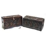 Two African tribal wooden chests deeply carved with figures, the largest 74cms wide (2).