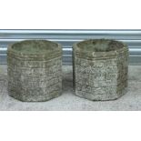 A pair of reconstituted octagonal stone planters, each 35cms wide (2).