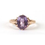 A 9ct gold and amethyst solitaire ring, approx UK size 'K'.