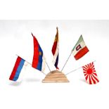 Five 1930's miniature National Flags to include Japan, on a wooden stand.