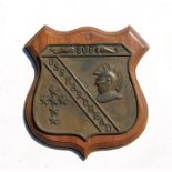 A bronze plaque for 'USS Hardhead' submarine, mounted on a wooden plaque, 24cms wide.
