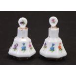A pair of late 19th / early 20th century miniature Meissen scent bottles with stoppers decorated