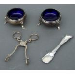 A pair of George III silver salts on three hoof feet with blue glass liners, London 1770; together