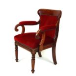 A 19th century mahogany desk chair with upholstered seat and back, on octagonal tapering front