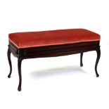 A late 19th century mahogany duet stool with upholstered lift-up top, 98cms wide.Condition