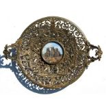 A gilt brass dish commemorating York Minster with pierced and central vignette of York Minster,