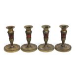 A set of four French Empire style brass dwarf candlesticks with detachable sconces, each 12cms
