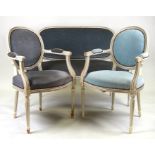 A French three-piece salon suite with upholstered seats and backs and white painted show wood.