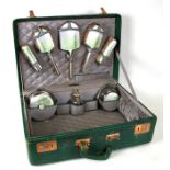 A silver and guilloche enamel dressing table set, Birmingham 1947/48, decorated with lilies of the