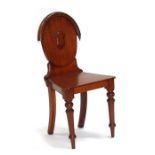 A Victorian mahogany hall chair.