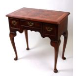 A Georgian style figured walnut veneered lowboy, 74cms wide.Condition Reportmodern copy, general