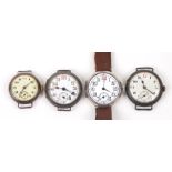 Four WWI trench watches, each with wire lugs (4).