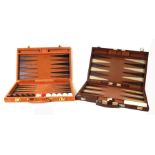 Two boxed backgammon sets.