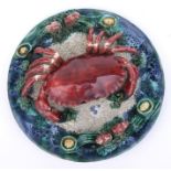A Palissy style plate decorated with an applied crab, 25cms diameter.Condition ReportThere is a
