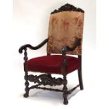 An 18th century style mahogany carver chair with upholstered seat and back.