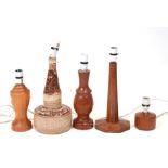 A quantity of mid 20th century table lamps to include a German pottery example and a faceted