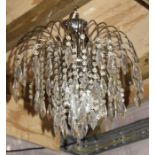 A silver plate and crystal drop ceiling light.