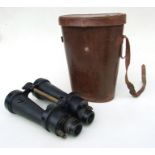 A pair of WW2 Royal Navy Barr & Stroud binoculars with internal coloured filters in their leather