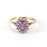 A 9ct gold amethyst and white stone cluster ring, approx UK size 'N'.