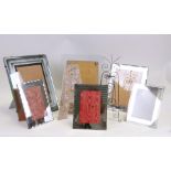 A collection of Art Deco glass strut photo frames, the largest 36cms high.