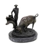 A large modern bronze group depicting a bull and matador, on a marble base, 24.5 cms (9.5 ins)