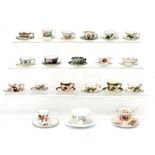 A large quantity of miniature cups and saucers to include Masons, Coalport and Wedgwood.