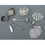 A group of small silver items to include two nurses buckles; a continental silver coin purse and a