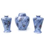 A pair of Burleigh Ware vases decorated with flowers on a blue ground, 21cms high; together with a