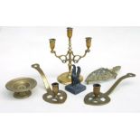 A group of metalware to include two Scottish brass Luckinbooth candlesticks, a spelter griffin on
