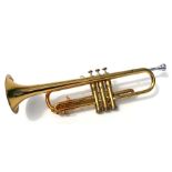 An Olds USA Ambassador B-flat brass trumpet with mouth piece, cased.