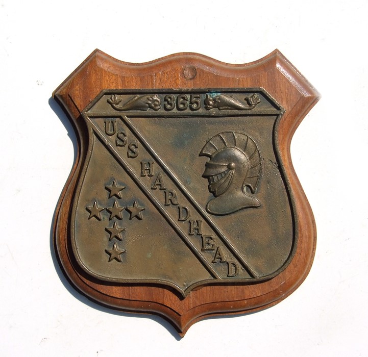 A bronze plaque for 'USS Hardhead' submarine, mounted on a wooden plaque, 24cms wide.