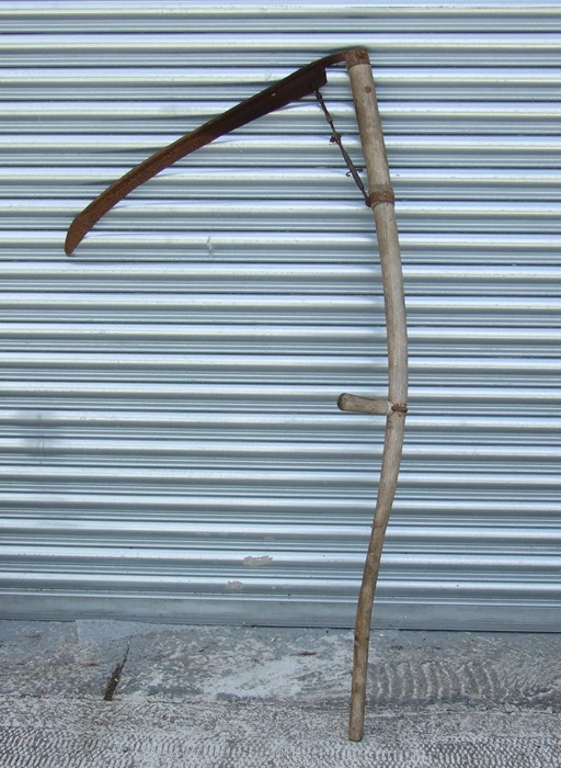 A vintage garden scythe.