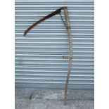 A vintage garden scythe.