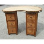 A pine kidney shaped twin pedestal dressing chest, 107cms wide.