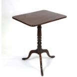 A Victorian mahogany tripod table with mahogany rectangular top, on turned column terminating in a