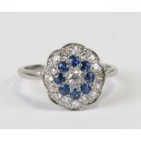 A platinum, diamond and sapphire cluster ring, weight 3.8g, approx UK size 'N'.Condition