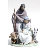 A large Lladro nativity scene figural group, 37cms high.Condition ReportThe wooden staff has been