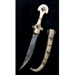 A Middle Eastern Jambiya dagger and scabbard, 38cms long.