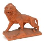 A terracotta figure depicting a male lion, 44cms wide.