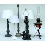 An Arts & Crafts style copper and wrought iron table lamp, 61cms high; together with five other