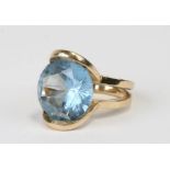 A 14ct gold cocktail ring set with a large pale blue topaz, total weight 10.4g, approx UK size 'M'.