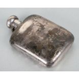 A silver hip flask with indistinct Birmingham hallmark, 14.5cms high.