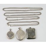 An Edwardian silver Vesta case, together with two white metal oval lockets; and four silver